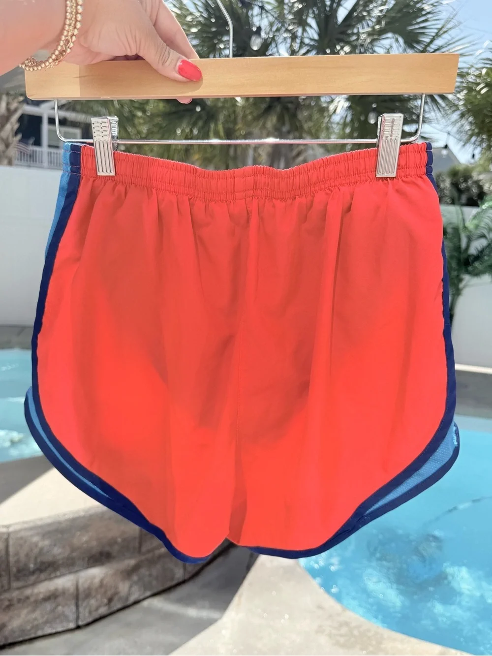 Nike Women's Coral Red Athletic Shorts with Blue Trim